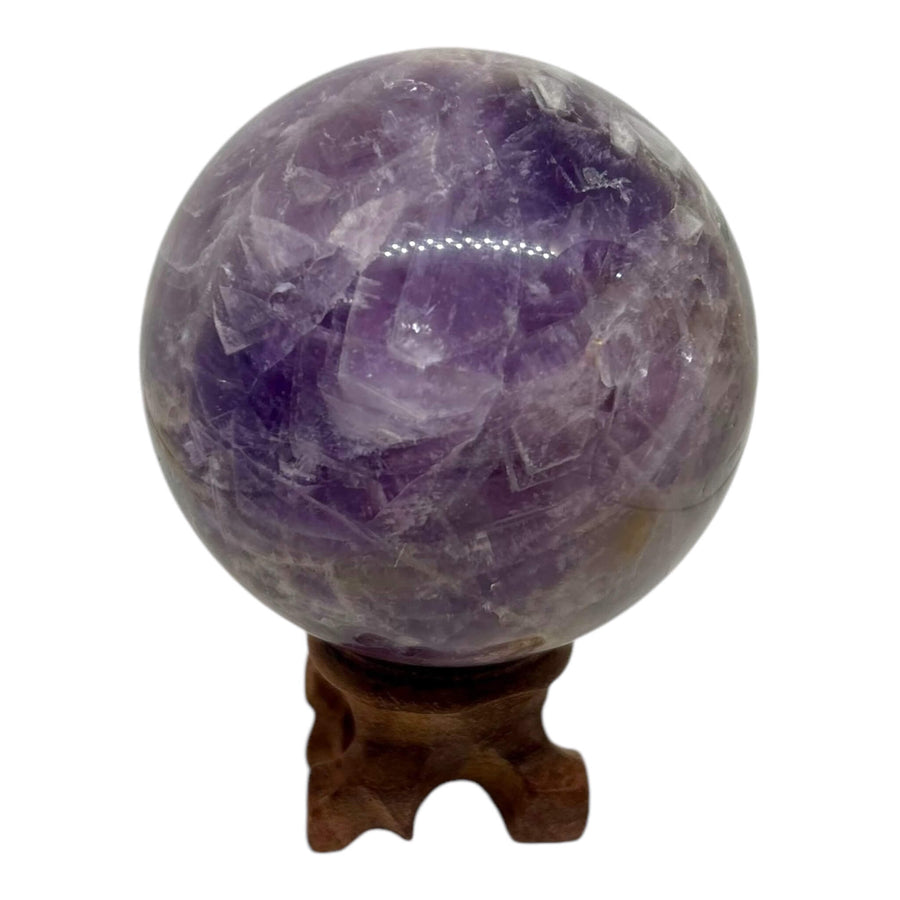 Hand-polished Amethyst Sphere (6"), featuring rich purple hues and a smooth, reflective surface. A unique Amethyst crystal ball symbolizing intuition, tranquility, and emotional balance. Perfect for meditation, energy healing, and home decor.