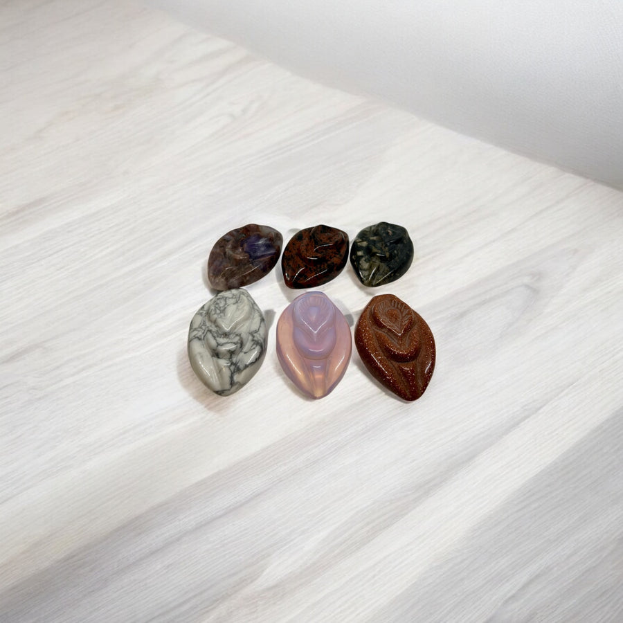 Super seven, mahogany obsidian, and Numite. Front row  Magnesite, Opalite, Goldstone